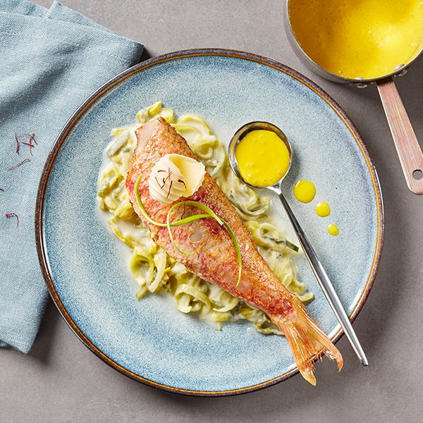 Red mullet in saffron sauce on leek fondue recipe with Isigny PDO Butter